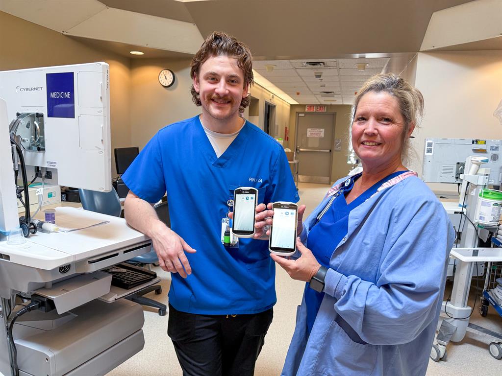 Staff Holding Mobile Devices